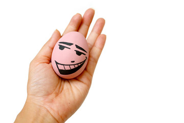 Perfect colorful handmade easter eggs with smile eggs in human hand isolated on a white background. Easter day concepts. Funny decoration. Happy Easter.