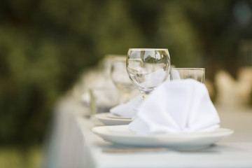 Glasses for wine and champagne on a served table at a banquet