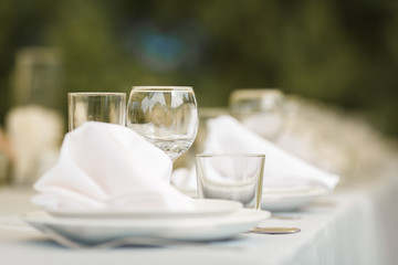 Glasses for wine and champagne on a served table at a banquet