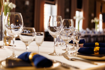 Wine glasses and champagne flutes on table, Wedding decor. Selective focus