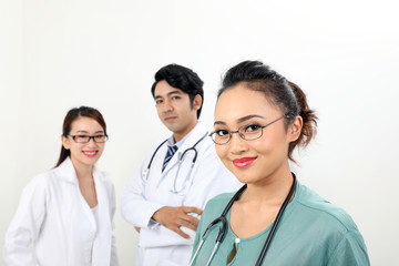 Young asian malay chinese male female doctor on white background smile confident looking at camera