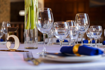 Wine glasses and champagne flutes on table, Wedding decor. Selective focus