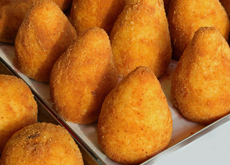 fried balls made with rice and peas called ARANCINI in the Itali