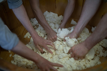 Obraz na płótnie Canvas traditional farm mozzarella cheese manual preparation