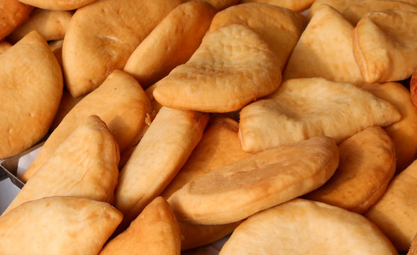 Panzerotto baked pizza language for sale at market in Naples