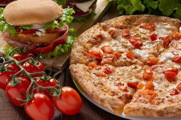 Pizza and hamburgers. Fast food. Still-life.