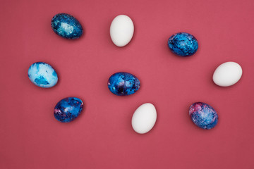  Easter colorful painted eggs. Purple background.