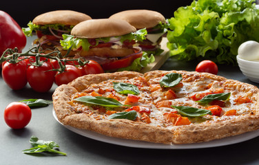 Pizza and hamburgers. Fast food. Still-life.