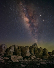 Beauty of night sky and milky way photography with the thousand stars above the big exotic stone