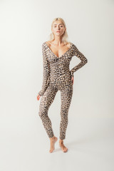 Beautiful, sexy blond model, dressed only in elegant leopard fur and sensual lingerie.