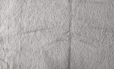 Gray crumpled textile, terry cloth background and texture