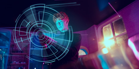 Man using interface modern technology, digital layer with VR headset as economics learning concept. Analyzing situation with world's finance position while crisis and pandemic, business strategy.
