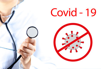 The doctor holds a black stethoscope with his hand. Concept: fight against coronavirus covid-19