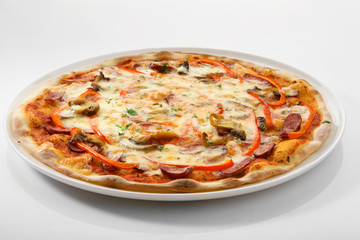 Flatlay of Italian pizza on wooden background. Rustic homemade pizzas with salami, bacon,  cheese, eggs and raw vegetables on shabby wooden background. Healthy vegetarian fungi pizza