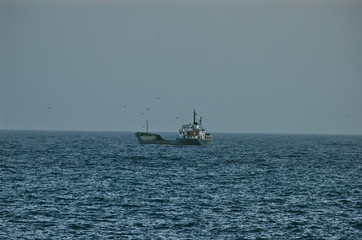 Lonley Boat In The Blue Sea