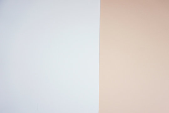 Pink and white paper devided background.