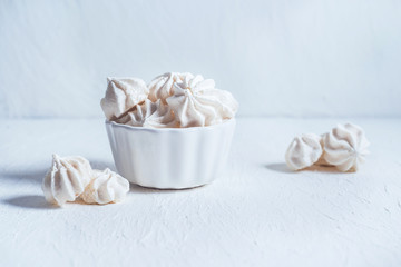 white meringues on a white background