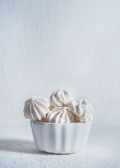 white meringues on a white background