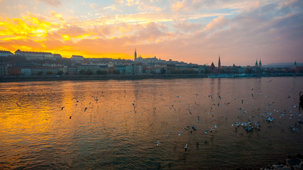 Danube river and historic buildings at sunset in Budapest, Hungary