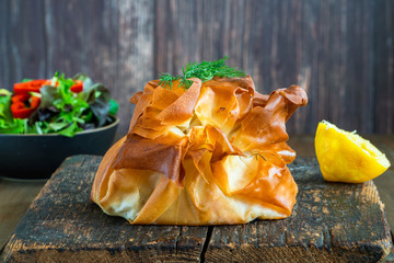 Coulibiac - Russian type of pirog filled with salmon stuffed with rice, mushrooms,onion,dill and hard-boiled egg - obrazy, fototapety, plakaty