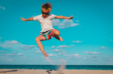 Fototapeta na wymiar happy boy play on beach, kid enjoy sea vacation