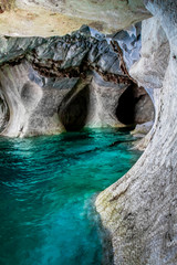 natural marble rocks and crystal clear water in caverns