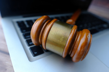 Close up of gavel on laptop, law and security concept 