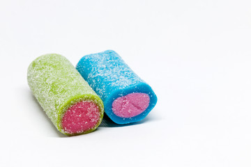 a blue and green candy roll on white background