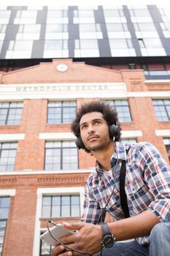 Young man listening to music.