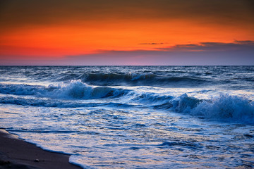 Fototapeta premium Sea waves and Beautiful dawn sunrise at sea. Seascape.