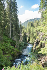 Fototapeta na wymiar Mountain full-flowing river