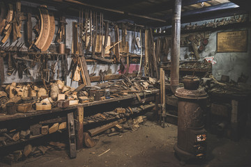old repair shop with a study firewood for the cold