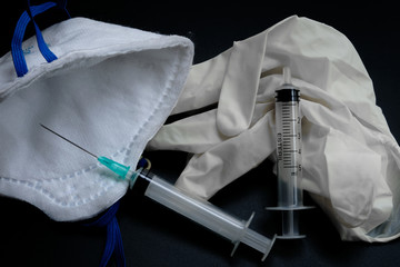 A small syringe into which a hollow, sharp-pointed bevel-cut needle is inserted and is used to inject medicinal substances into tissues or organs.