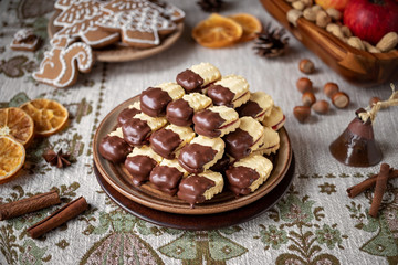 Christmas cookies filled with marmalade and dipped in chocolate