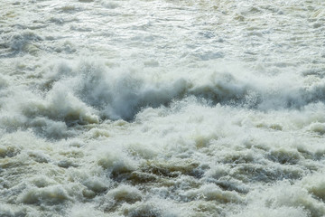 Splashing water waves on the spring fast river