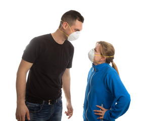 Man and woman with face masks don't keep distance while speaking. Coronaviruss concept