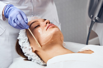 Obraz na płótnie Canvas Face Skin Care. Close-up Of Woman Getting Facial Hydro Microdermabrasion Peeling Treatment At Cosmetic Beauty Spa Clinic. Hydra Vacuum Cleaner. Exfoliation, Rejuvenation And Hydratation. Cosmetology.