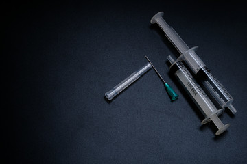 A small syringe into which a hollow, sharp-pointed bevel-cut needle is inserted and is used to...