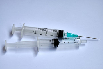 A small syringe into which a hollow, sharp-pointed bevel-cut needle is inserted and is used to...