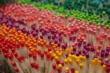 Colorfull ballpens standing on the stationery desk
