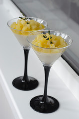 Panna cotta with pear and orange in a glass