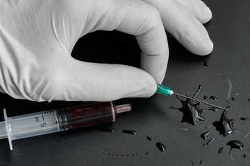 A small syringe into which a hollow, sharp-pointed bevel-cut needle is inserted and is used to...