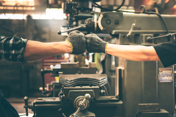 Experienced entrepreneurs, 2 engineers man Used hand for fist bump to show their cooperation For...
