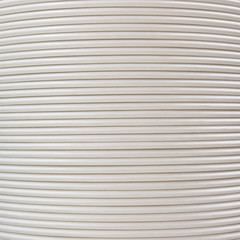 Obraz premium Background of white corrugated pipe. Texture of corrugation rings close-up