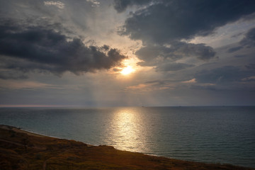 Naklejka na ściany i meble Dawn at the sea. Sea coast, stones. Black Sea.