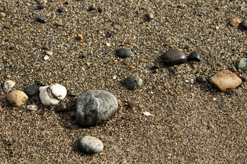 Scattered rocks on sand 