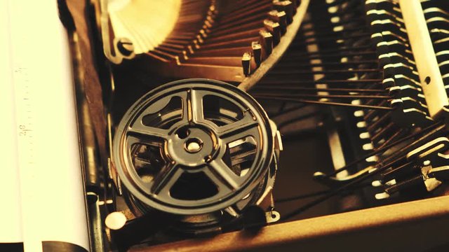 Mechanism and keyboard of an old typewriter with a film coil. Bright sunlight.