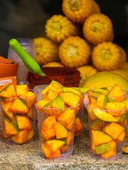 Sliced mangoes with mixed salt and chilly powder, tasty food items