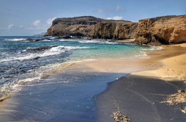 White and black sand beach in one, on the islet of Djeu, Cabo Verde