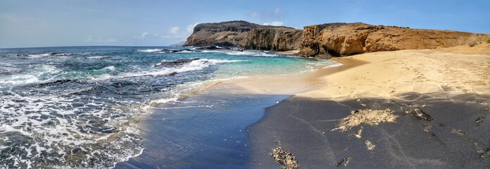Obraz premium White and black sand beach in one, on the islet of Djeu, Cabo Verde